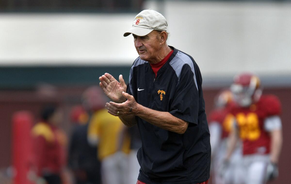 Monte Kiffin, USC defensive coordinator, claps during a team practice in October 2011.