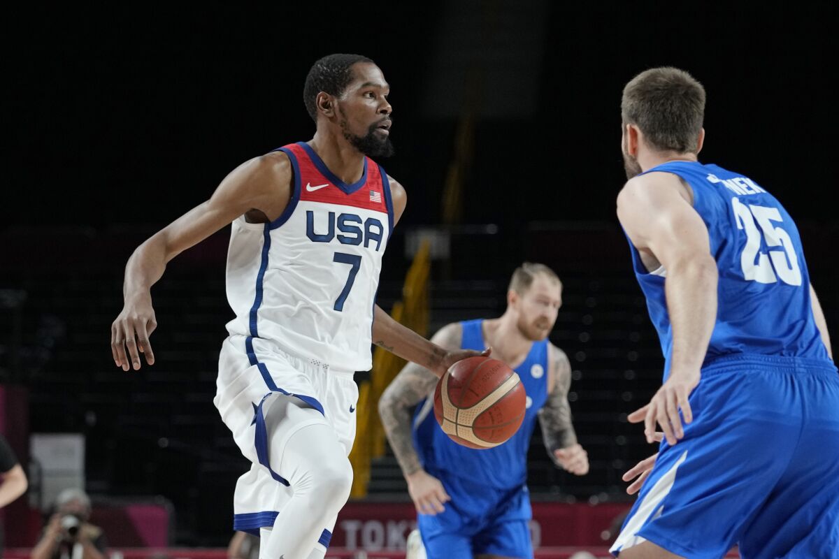 U.S. forward Kevin Durant, left, brings the ball up court during a 119-84 victory over the Czech Republic.