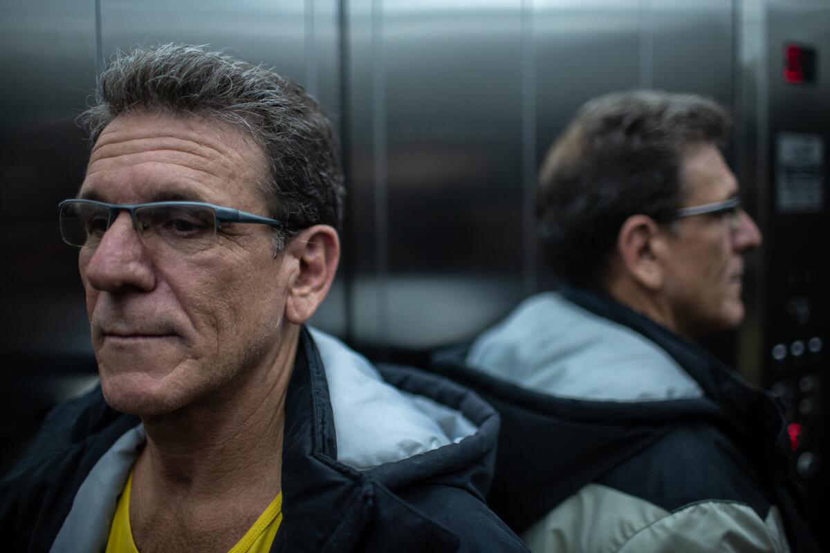 Fabio Alberto Alves takes the elevator to a meeting of E Agora, Jose?, a therapy group for men serving alternative sentences for domestic violence convictions.
