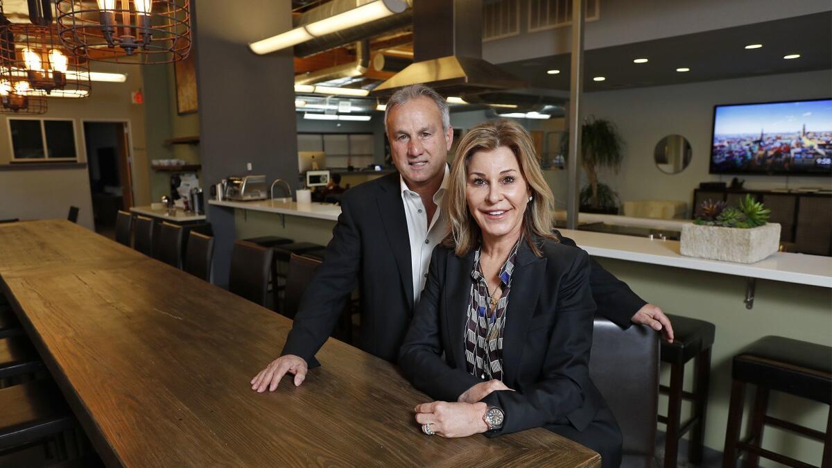 Bob's Watches Chief Executive Paul Altieri and his wife, Chief Operating Officer Carol Altieri, visit the break room at the company's Newport Beach headquarters.