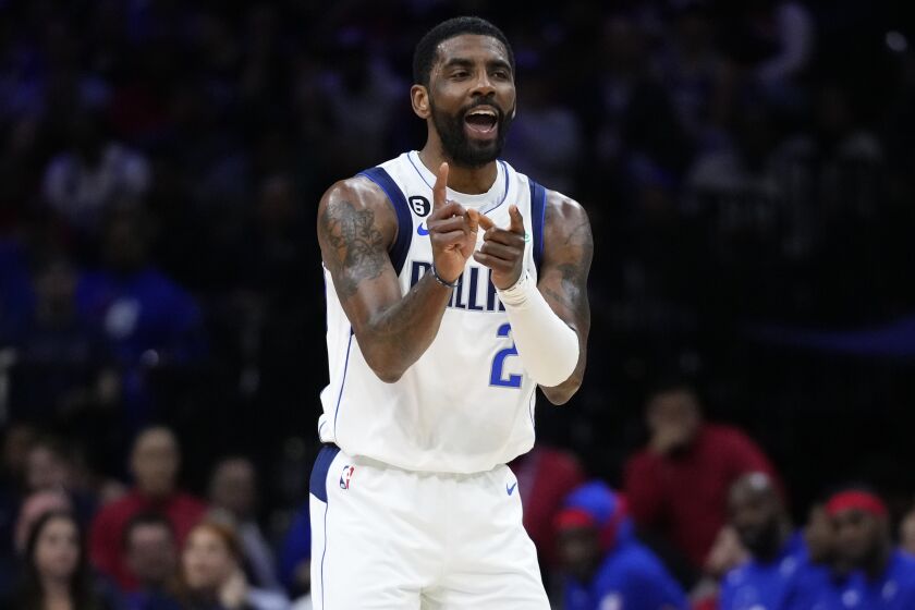 Dallas Mavericks' Kyrie Irving reacts during the first half of an NBA basketball game against the Philadelphia 76ers, Wednesday, March 29, 2023, in Philadelphia. (AP Photo/Matt Slocum)