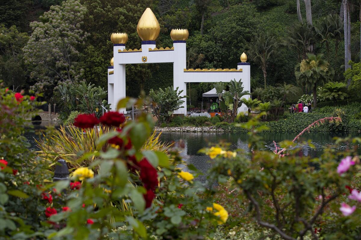 The Golden Lotus Archway stands across the water at the Self-Realization Fellowship Lake Shrine in Pacific Palisades.