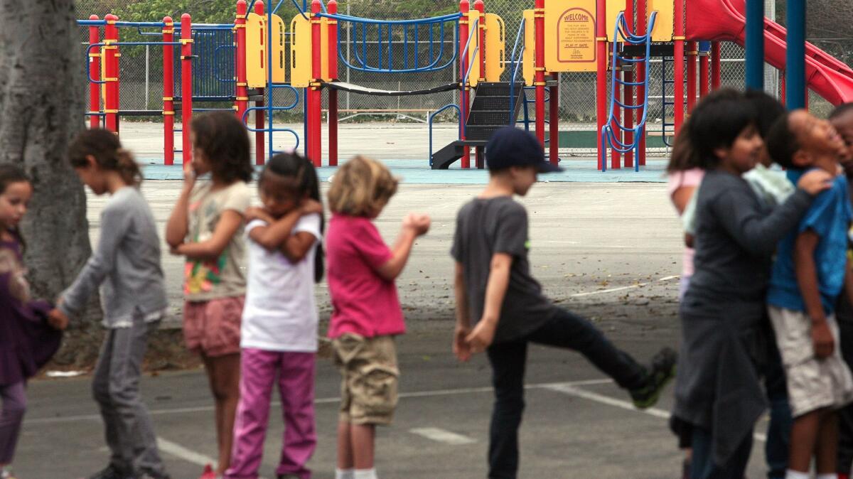 Students line up across from the playground at Citizens of the World Charter School in Mar Vista in June 2014.