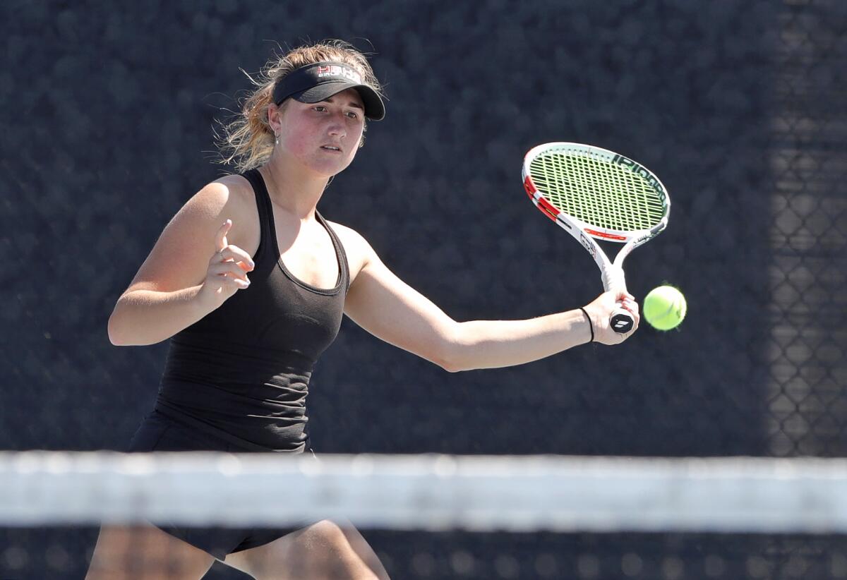 Huntington Beach No. 1 singles player Kaytlin Taylor runs down a volley on Tuesday afternoon.