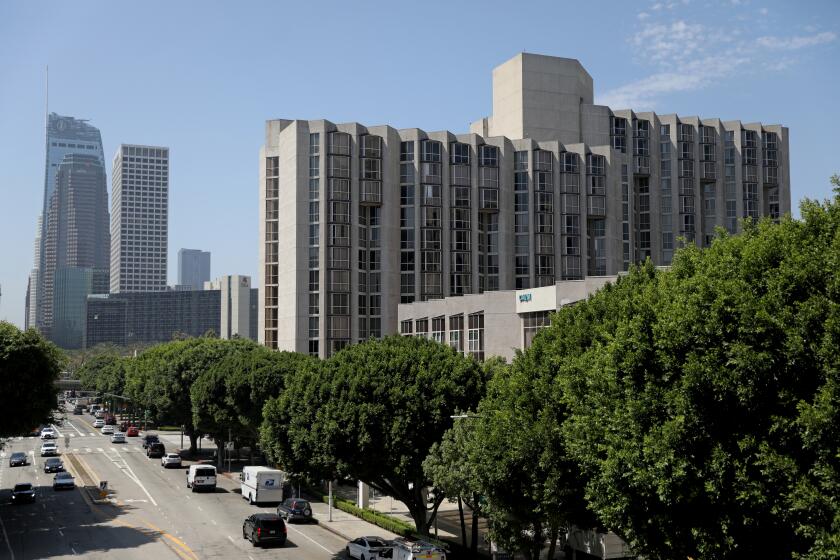 LOS ANGELES, CA - AUGUST 31: Promenade Towers, right, a large complex in Bunker Hill, on Thursday, Aug. 31, 2023 in Los Angeles, CA. The City of Los Angeles is now requiring landlords to file with the city any eviction notices that they've handed out to tenants. From late January through July of this year, landlords sent nearly 40,000 notices across the city. The property with the most eviction notices - 371 - was Promenade Towers, a large complex in Bunker Hill. (Gary Coronado / Los Angeles Times)