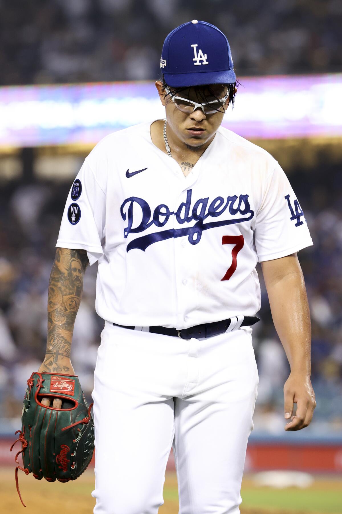 Dodgers starting pitcher Julio Urias walks off the field during the NLDS last year.