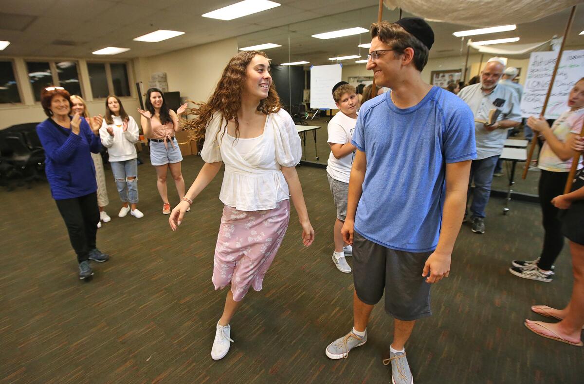 Sophia Gabal dances around Quinton Yusi during a rehearsal for "I Never Saw Another Butterfly," which is based on the true story of concentration camp survivor Raja Englanderova.