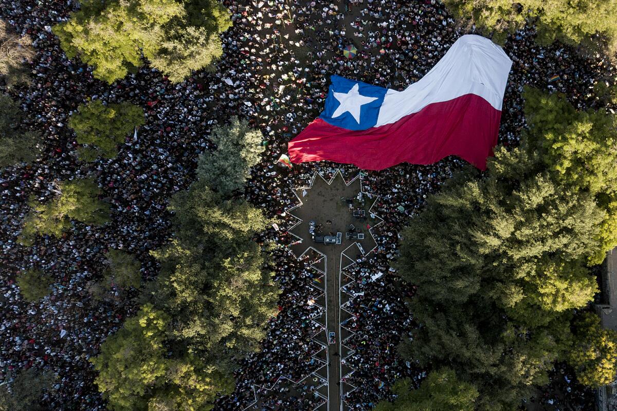 An aerial view of people standing on a crowded street 