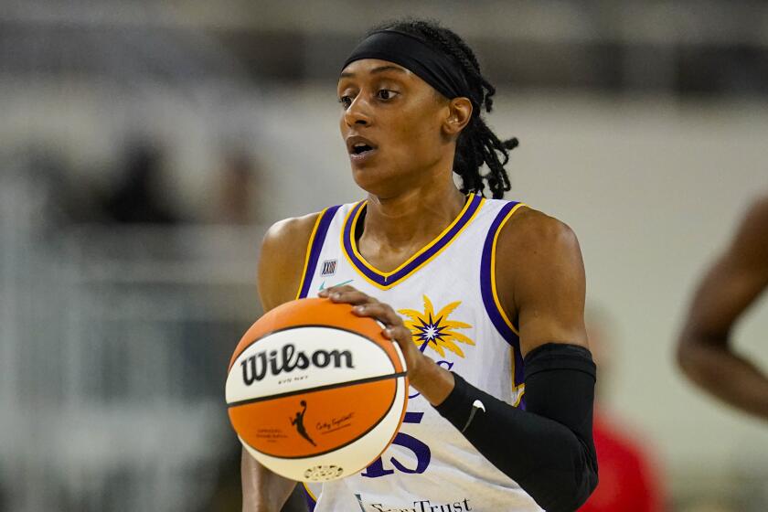 Los Angeles Sparks guard Brittney Sykes (15) plays against the Indiana Fever in the first half of a WNBA basketball game in Indianapolis, Tuesday, Aug. 31, 2021. (AP Photo/Michael Conroy)