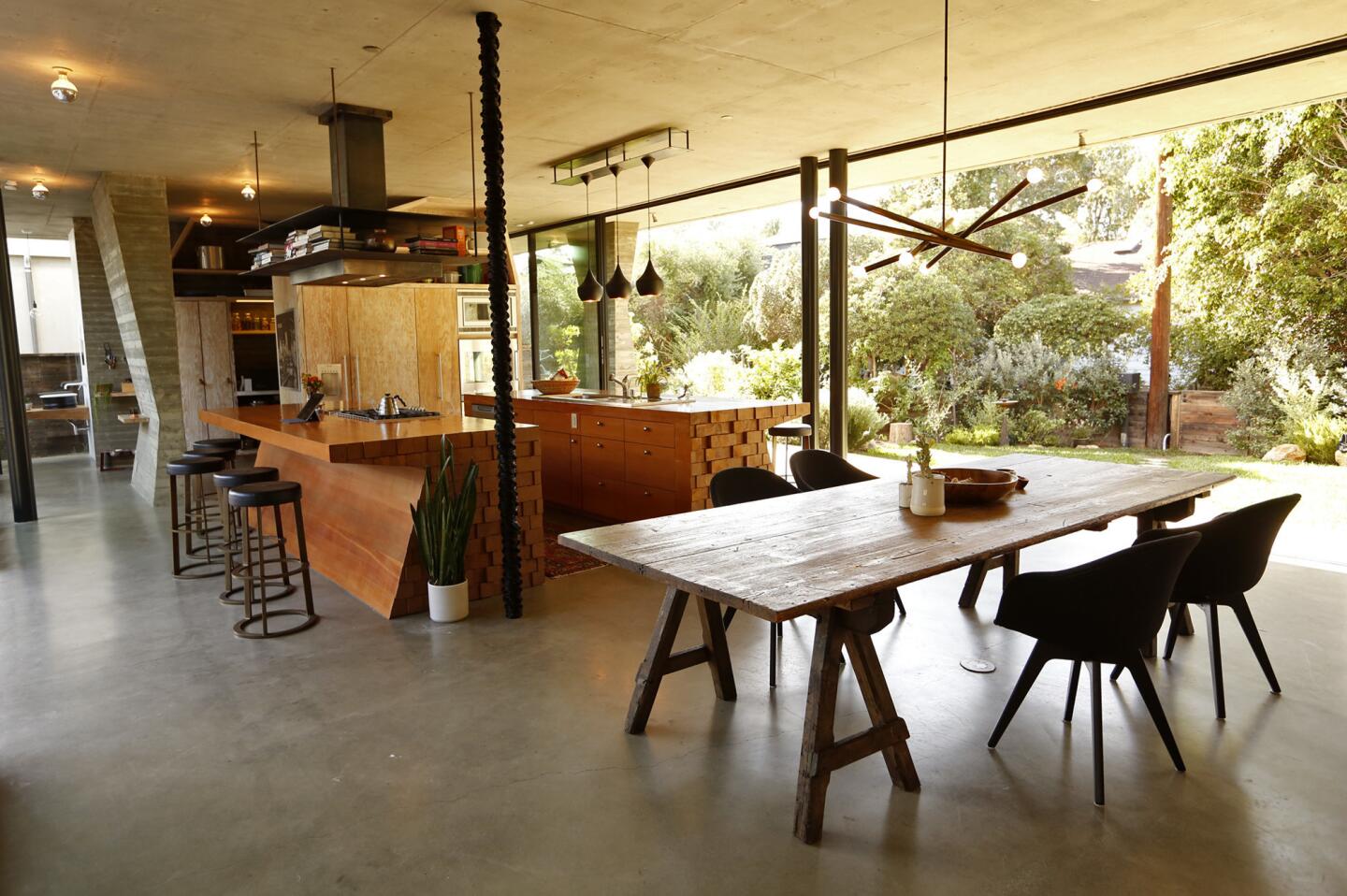 This dining room and kitchen in Venice emphasizes indoor-outdoor living. Full house tour here.