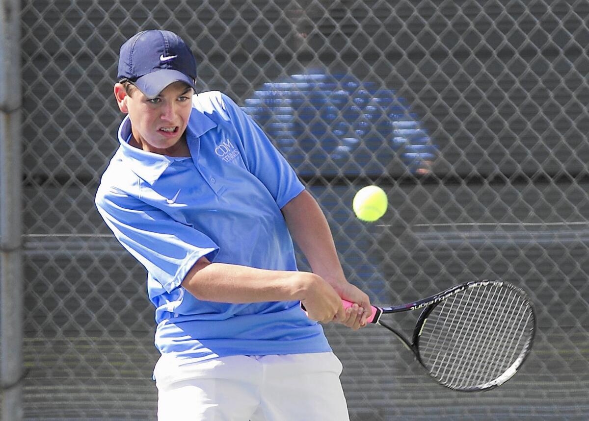 CDM's number one doubles player Diego Fernandez Del Valle rips a backhand at the baseline in match with partner Matt Paulsen against University on Wednesday.