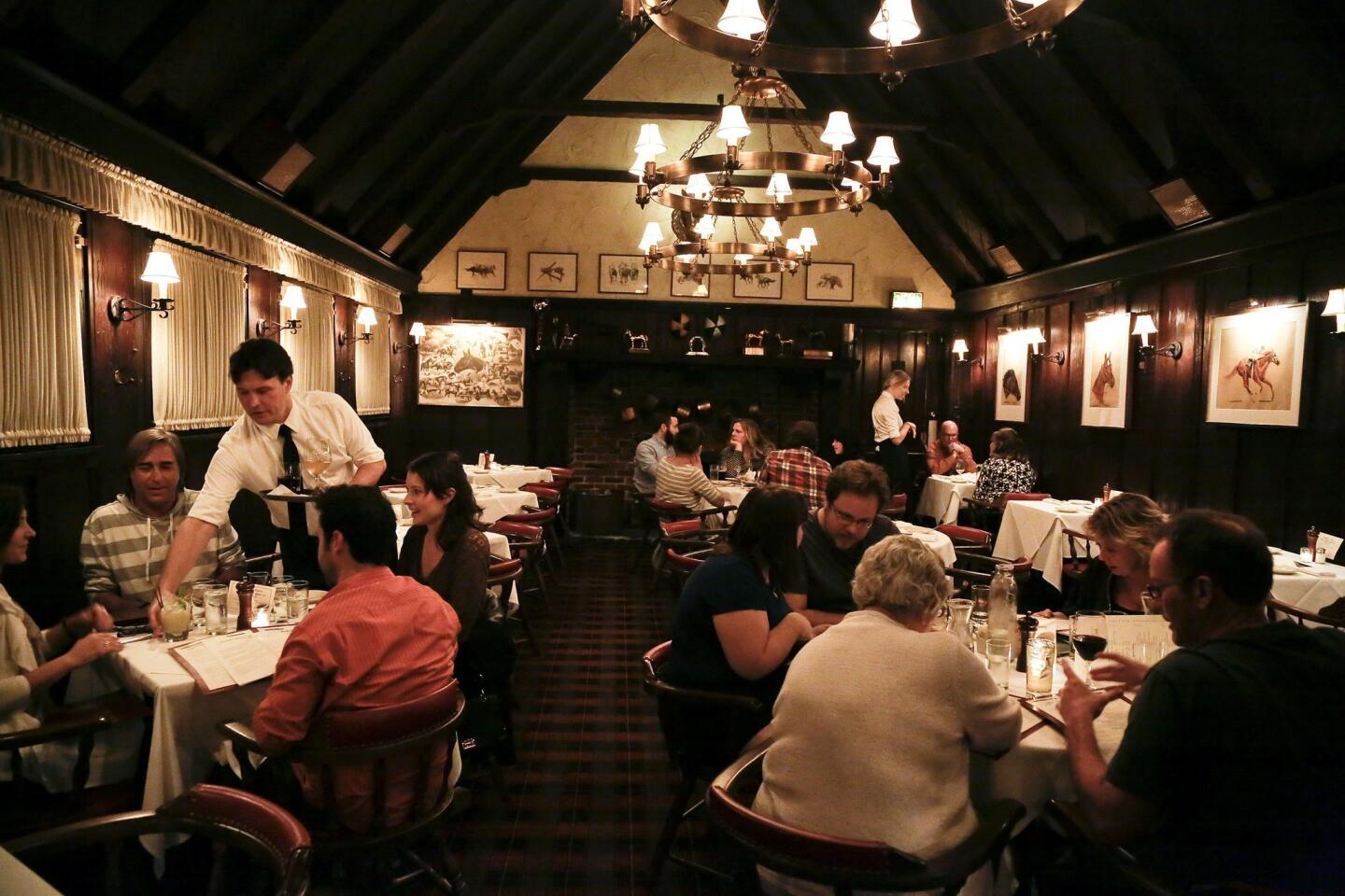 The main dining room at Tom Bergin's Tavern looks like the kind of place you'd see Raymond Chandler.