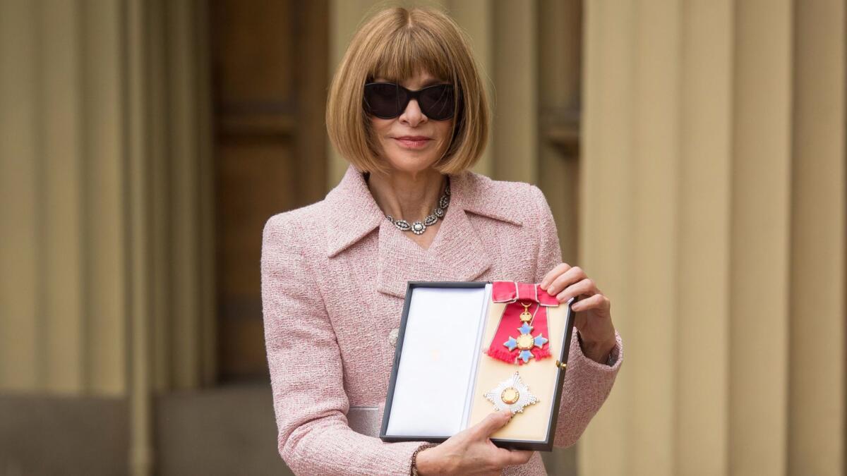 Anna Wintour holds her medal after being appointed Dame Commander of the Most Excellent Order of the British Empire (DBE) for services to fashion and journalism during an investiture ceremony held by Britain's Queen Elizabeth II at Buckingham Palace on May 5, 2017.