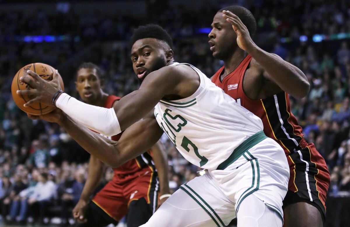 Celtics guard Jaylen Brown works in the post against Heat guard Dion Waiters during a game in December.