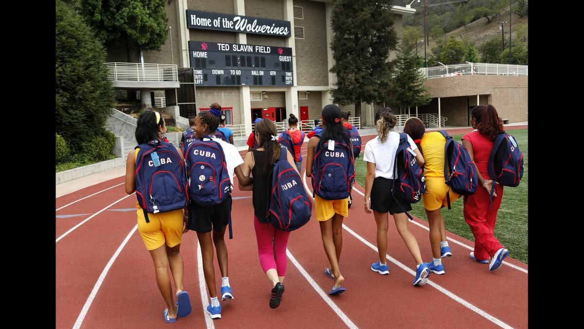 Members of the Cuban delegation to the Special Olympics arrive at Harvard-Westlake High School in Studio City for a practice session on July 22. The Cuban delegation consists of 16 athletes and coaches.