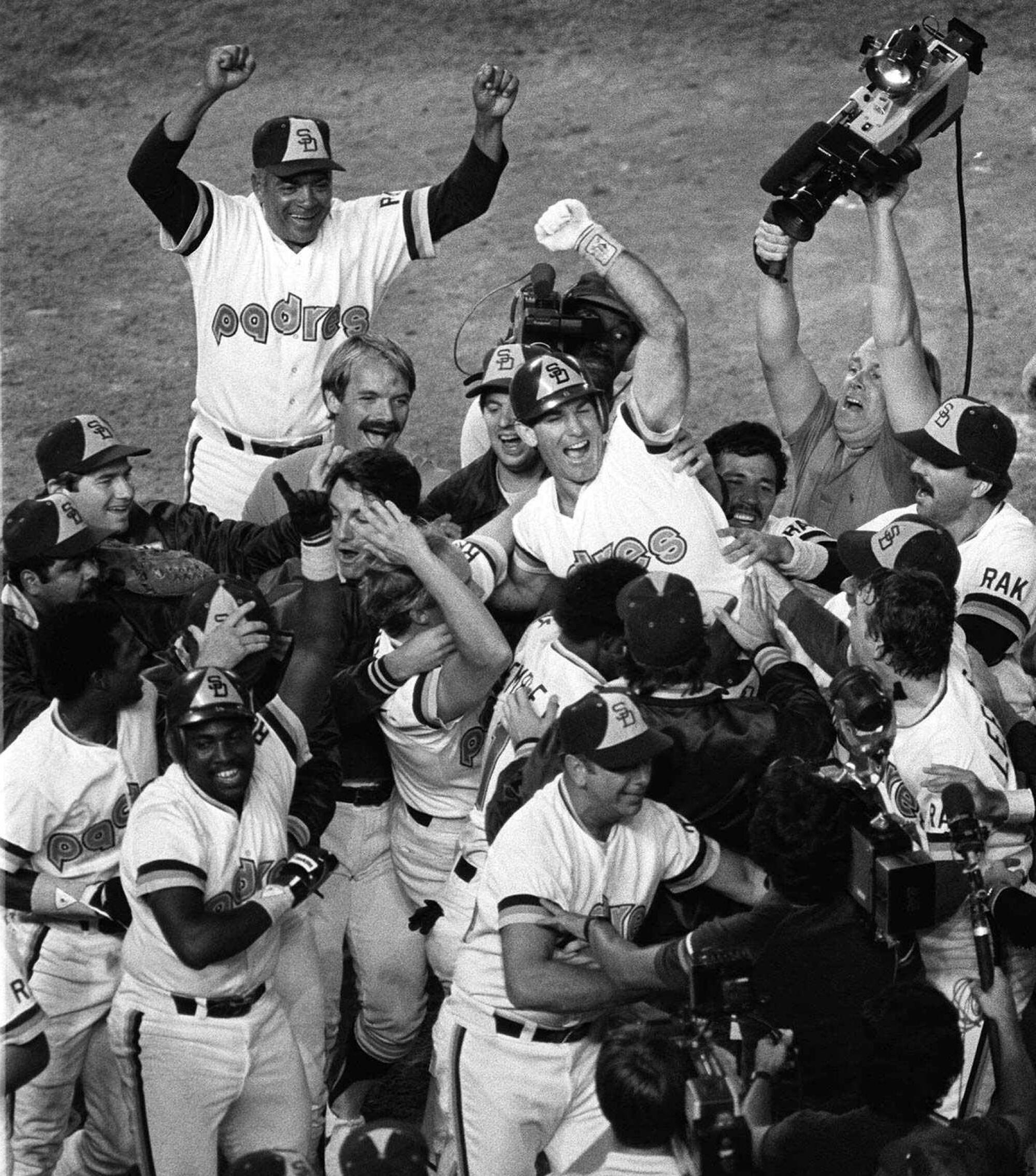 Steve Garvey is carried off the field by his San Diego Padres teammates after hitting a game-winning home run.