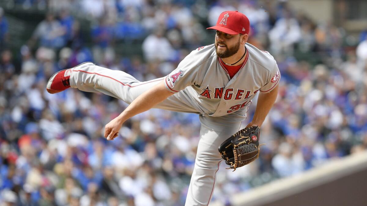 Starter Cam Bedrosian delivers during the first inning of the Angels' 8-1 loss to the Chicago Cubs.