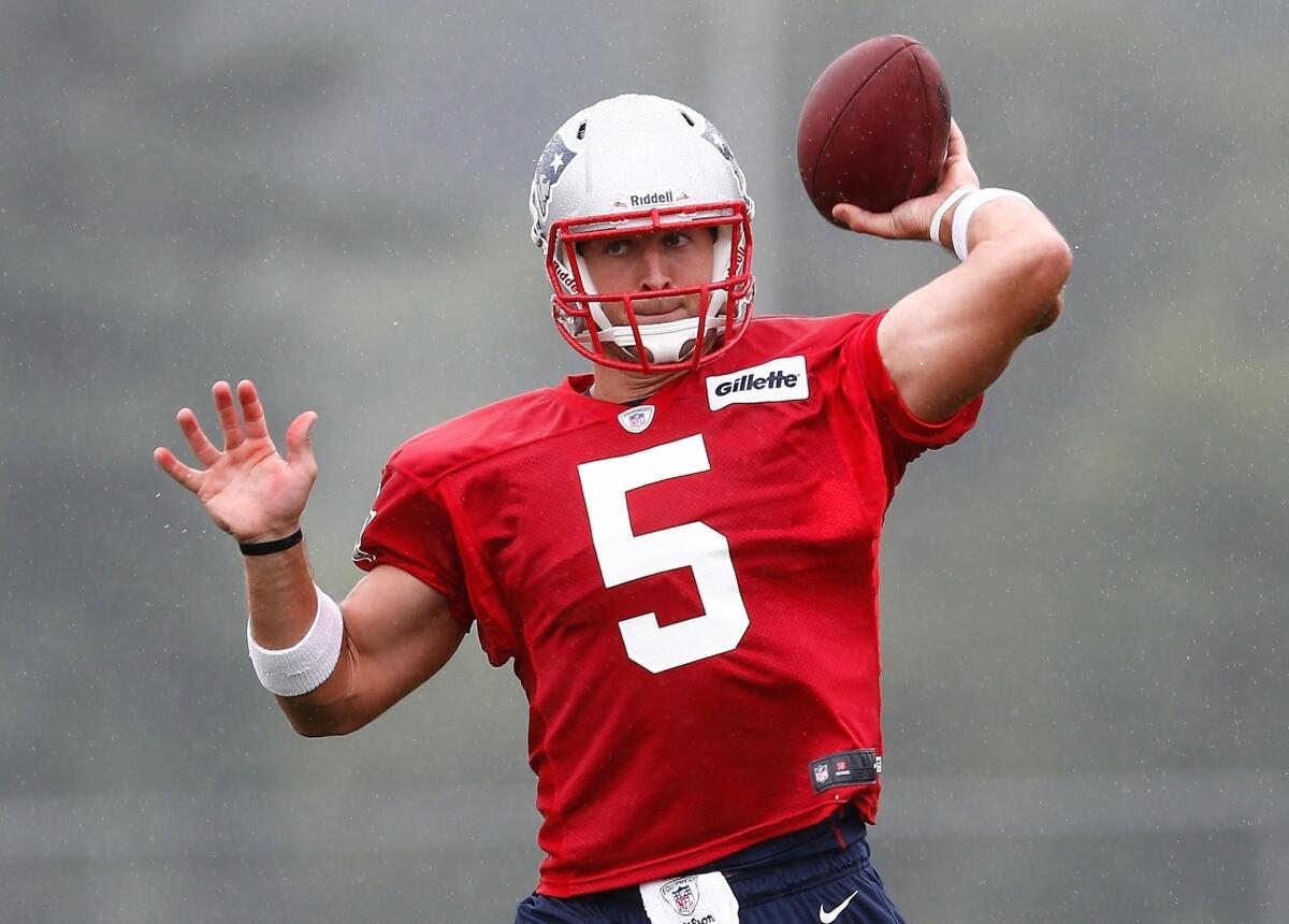 Tim Tebow works on his passing Friday at the New England Patriots' training camp.