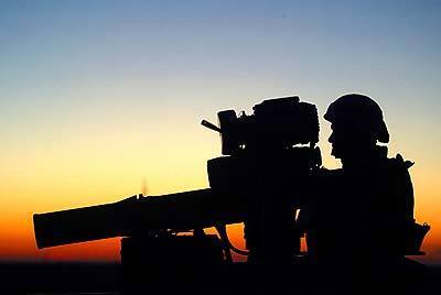 A U.S. gunner mans his TOW weapon, which is capable of piercing Iraqi tanks.