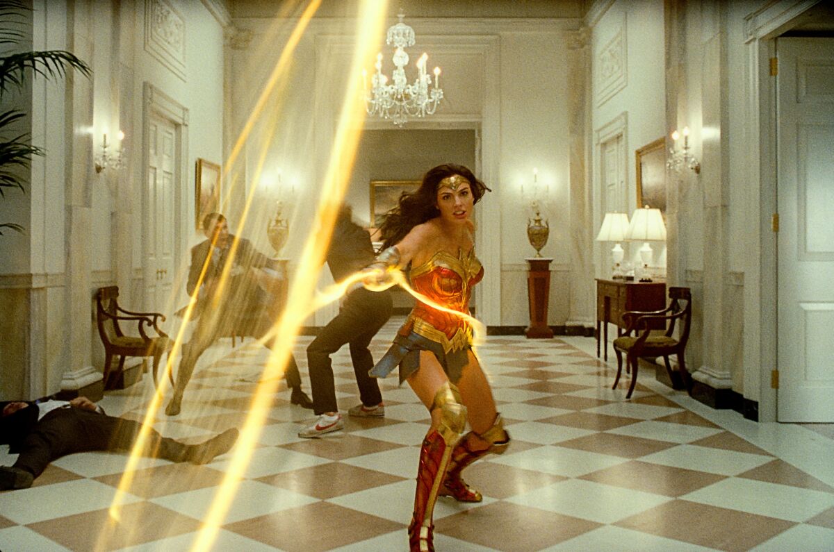 Gal Gadot throws her golden lasso as Wonder Woman.
