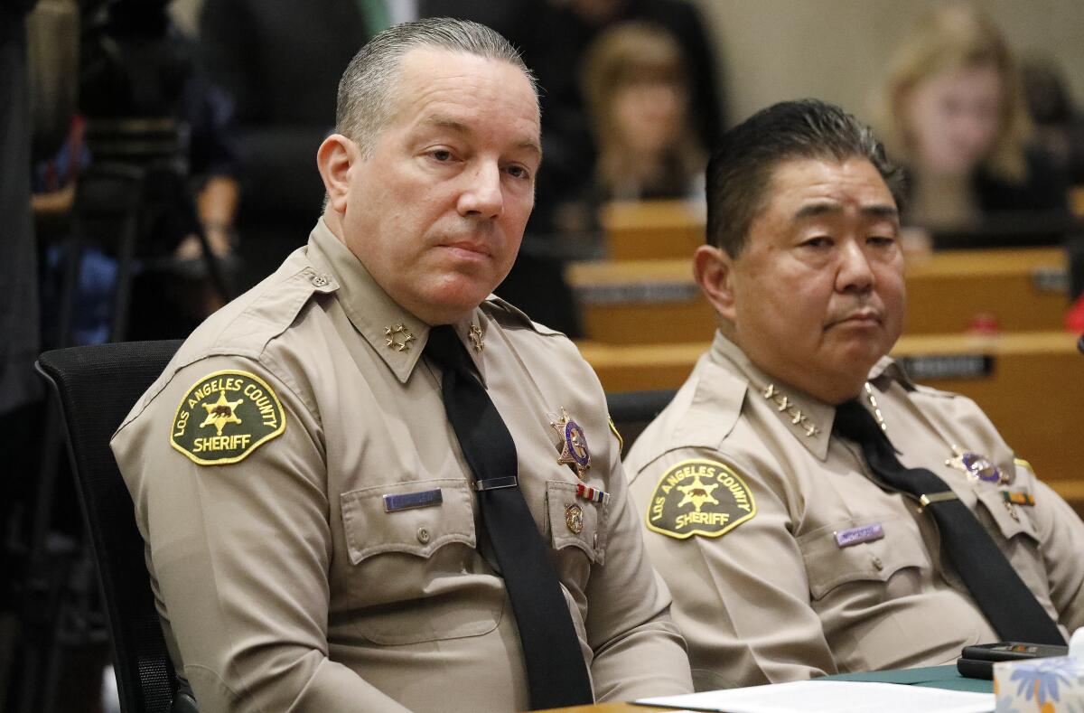 L.A. County Sheriff Alex Villanueva, left, and Undersheriff Tim Murakami at a Board of Supervisors meeting  in 2019.