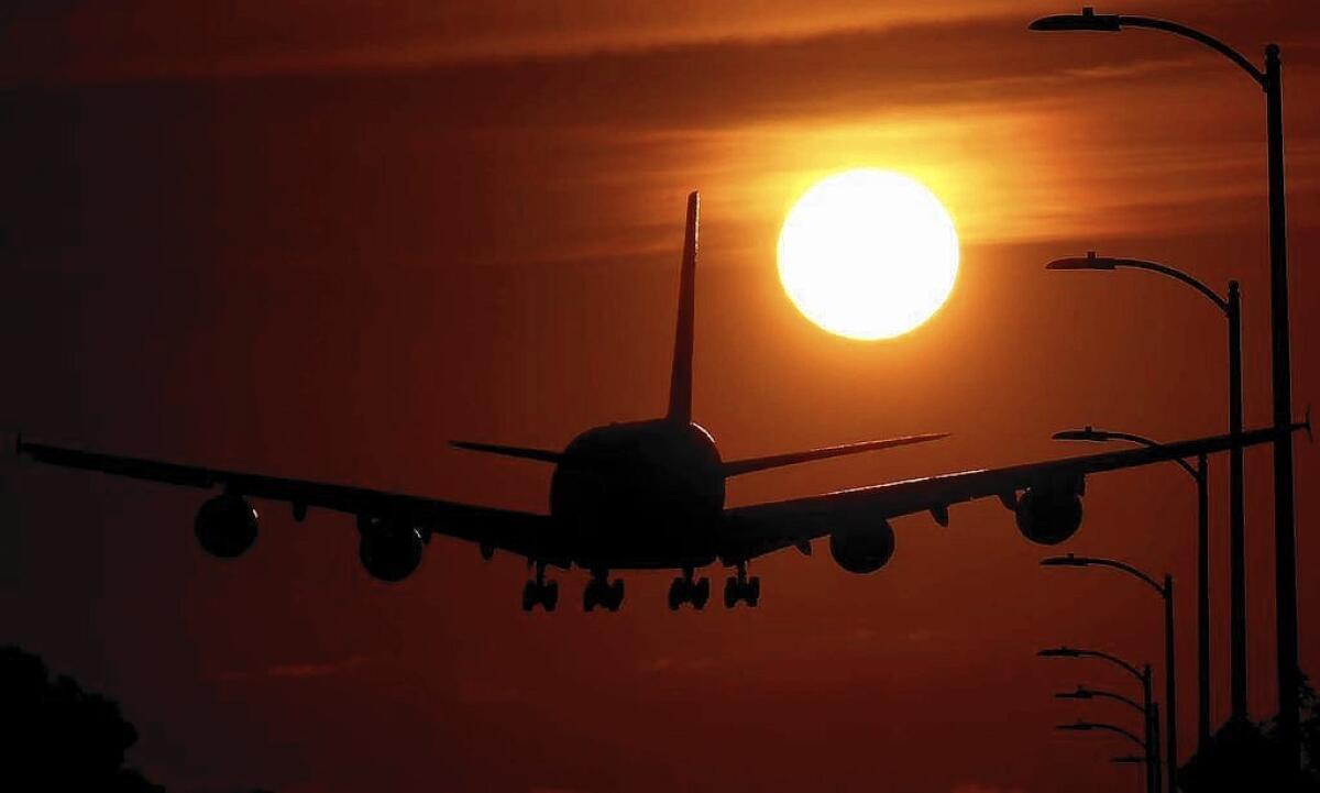 A plane lands at LAX. Culver City residents are complaining about an apparent increase in low-flying, noisy aircraft over their neighborhood.