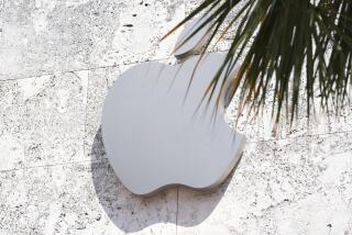 FILE - The Apple logo is displayed over their store, Sept. 19, 2023, in Miami Beach, Fla. Apple has agreed to pay $25 million to settle allegations that it engaged in a pattern of discriminatory hiring practices when filling some of its jobs during 2018 and 2019. The deal announced Thursday, Nov. 9, resolved a lengthy investigation by the U.S. Department of Justice into alleged violations of the Immigration and Nationality Act. (AP Photo/Marta Lavandier, File)
