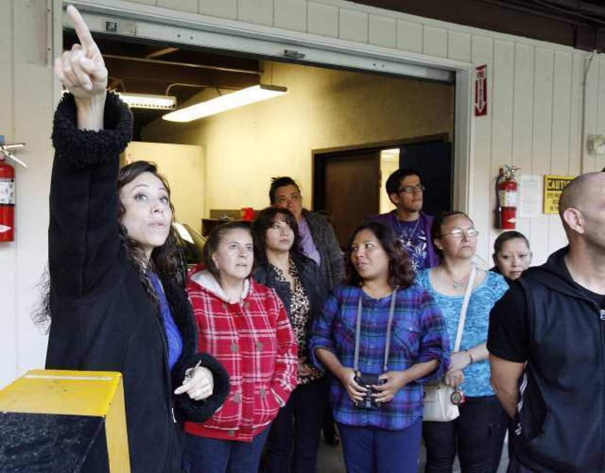 Burbank Police Officer Cindy Guillen directs a tour of the Burbank Police Department shooting range in Wildwood Park in Burbank. Police hosted a community academy for Latino residents to show them how the department works and makes life-or-death decisions.