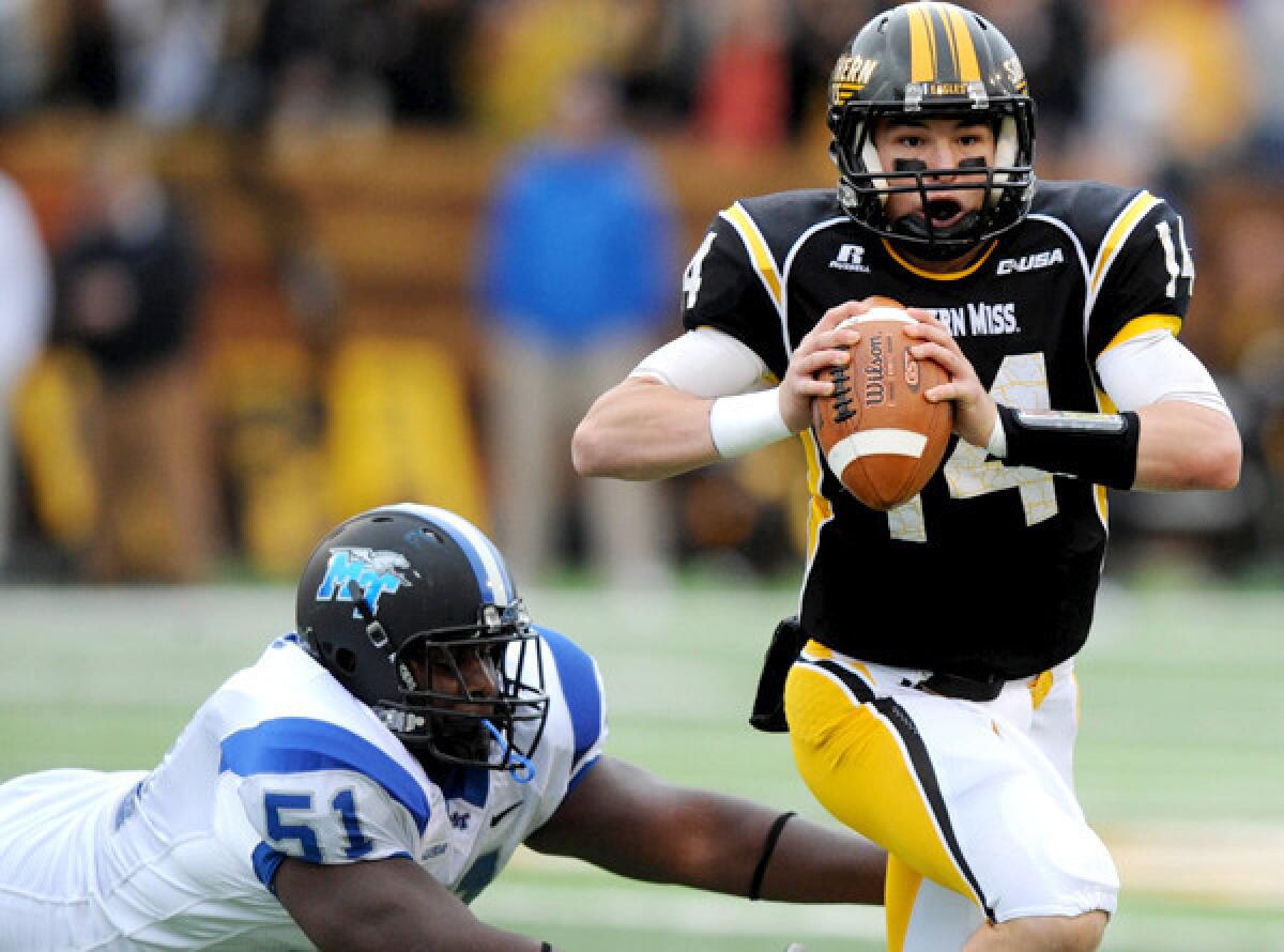 Southern Mississippi quarterback Nick Mullens, shown scrambling during a Nov. 23 game against Middle Tennessee, led the Eagles to their first win of the season on Saturday.