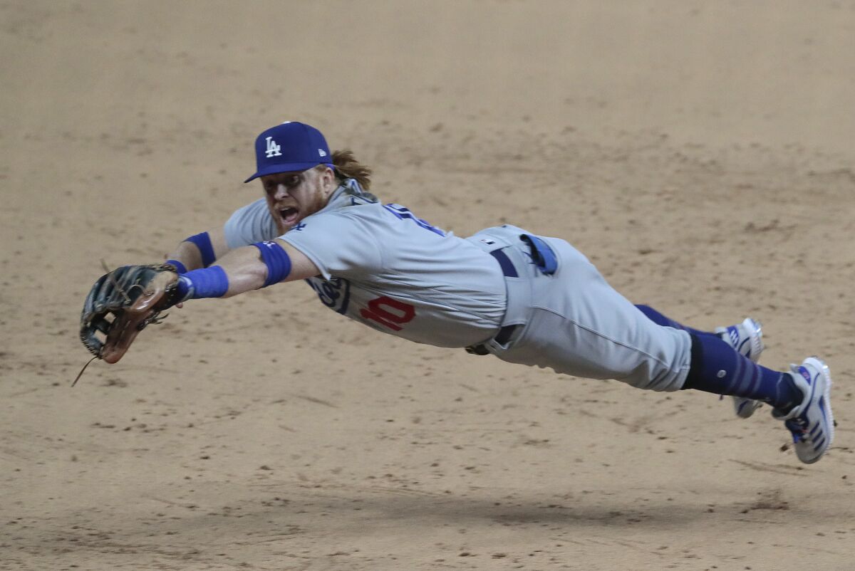 Dodgers third baseman Justin Turner dives for a ball during Game 4 of the NLCS against the Atlanta Braves on Oct. 15.
