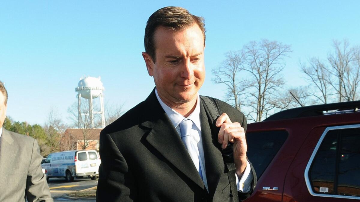 NASCAR driver Kurt Busch arrives at a protective court order hearing in Dover, Del., on Dec. 17.