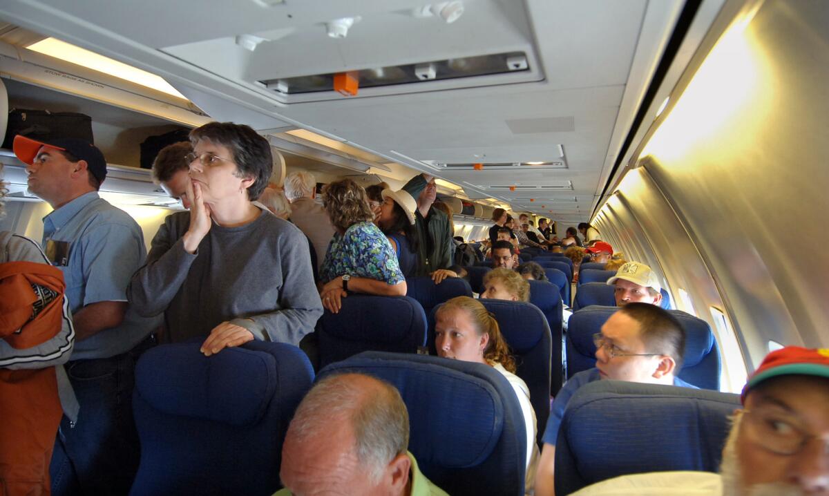 Passengers wait to deplane a United flight in Chicago.
