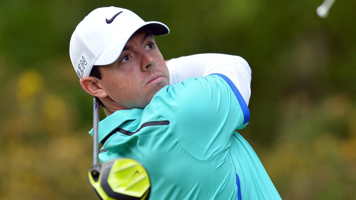 Rory McIlroy hits off the 13th tee during the first round of the BMW PGA Championship at Britain's Wentworth Golf Club on May 21.