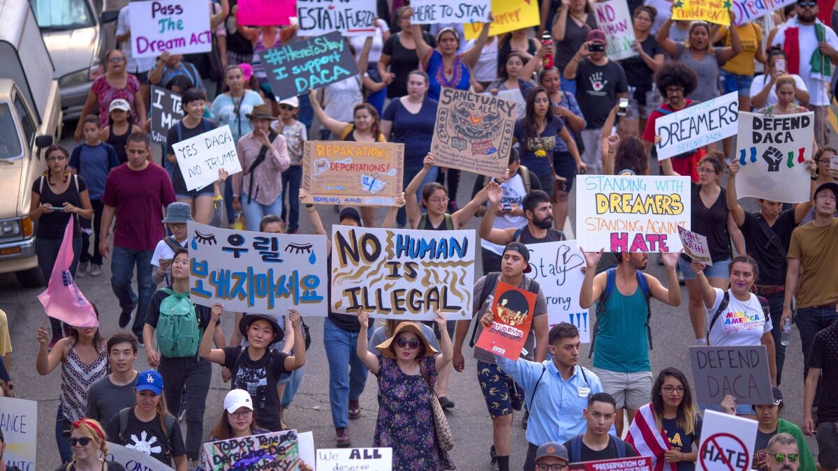 Immigrants and supporters march in Los Angeles on Sunday to oppose President Trump's order to end the Deferred Action for Childhood Arrivals, or DACA, program.