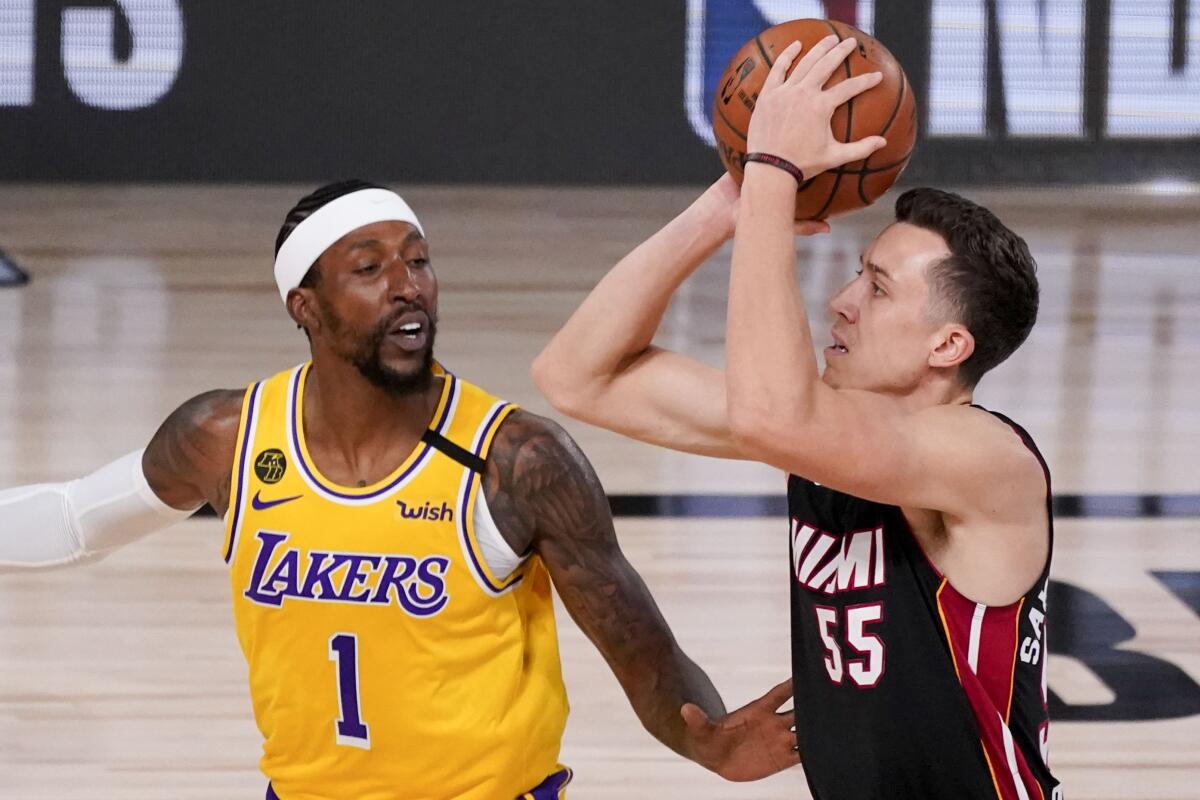 Heat forward Duncan Robinson shoots over Lakers guard Kentavious Caldwell-Pope during Game 4.