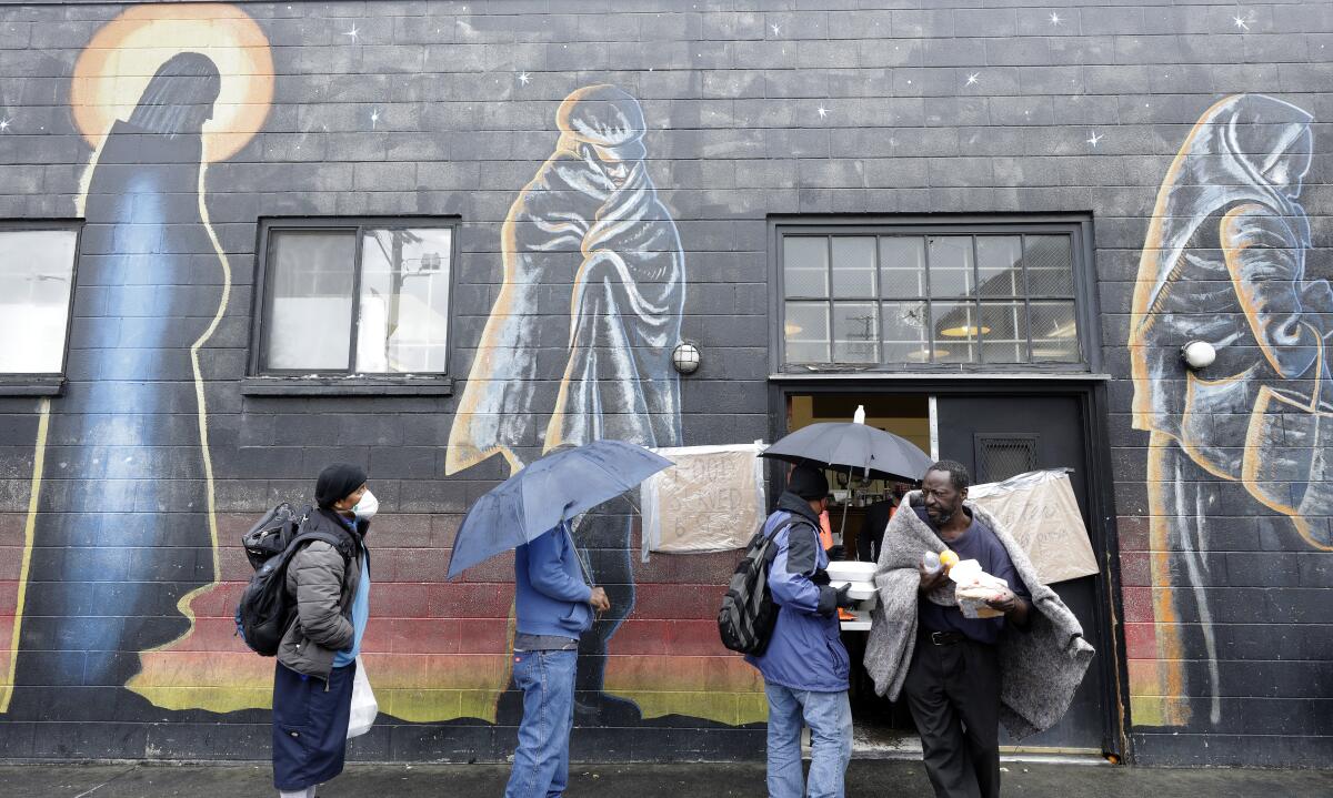 Hippie Kitchen hands out food, water, masks and toiletries on skid row