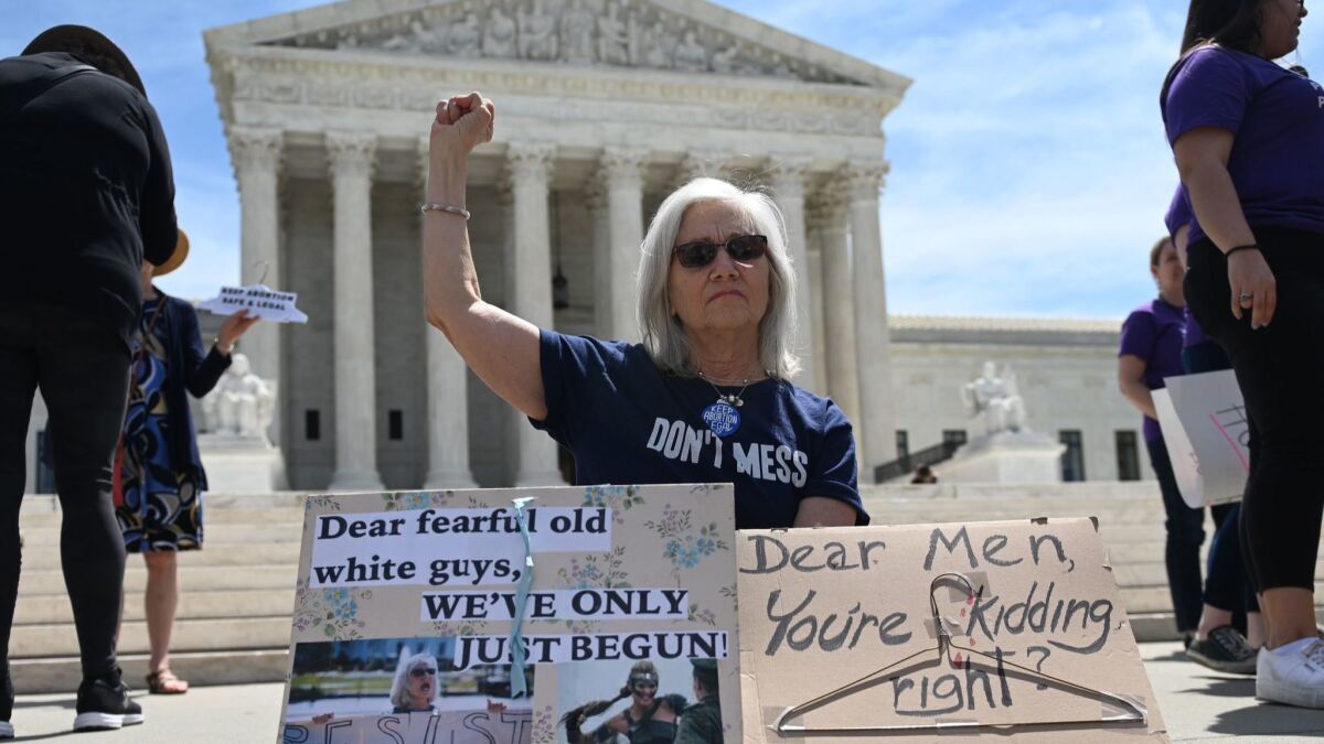 Abortion-rights activists rally in front of the U.S. Supreme Court in Washington on May 21.