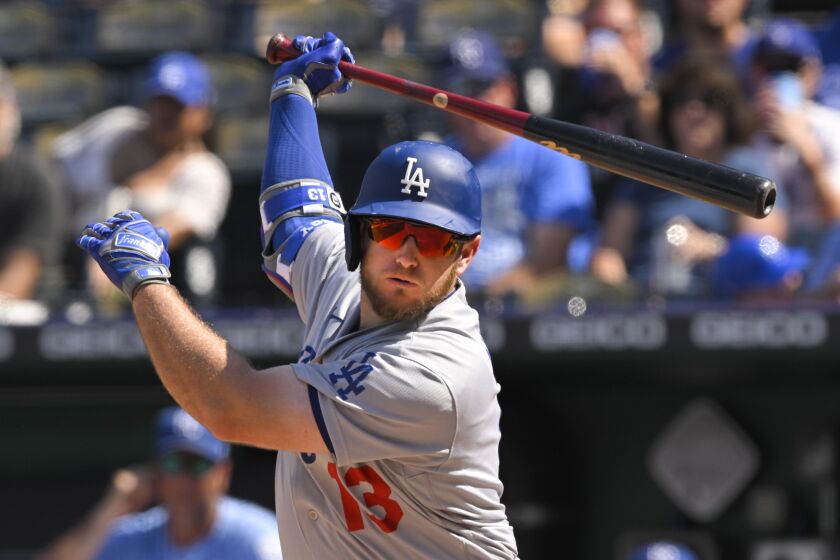 Los Angeles Dodgers' Max Muncy at bat against the Kansas City Royals during the eighth inning of a baseball game, Sunday, Aug. 14, 2022, in Kansas City, Mo. (AP Photo/Reed Hoffmann)