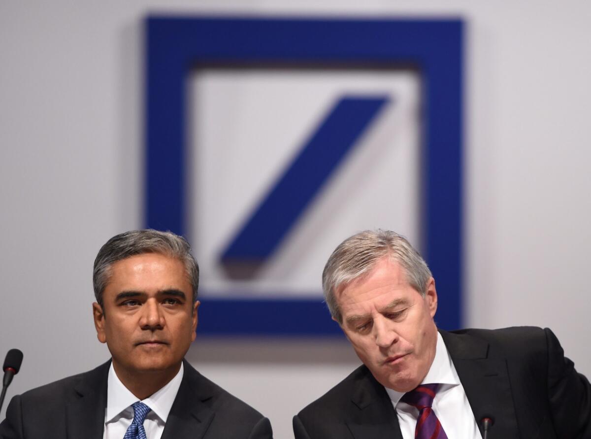 Anshu Jain, left, and Juergen Fitschen have agreed to step down as co-CEOs of Deutsche Bank.