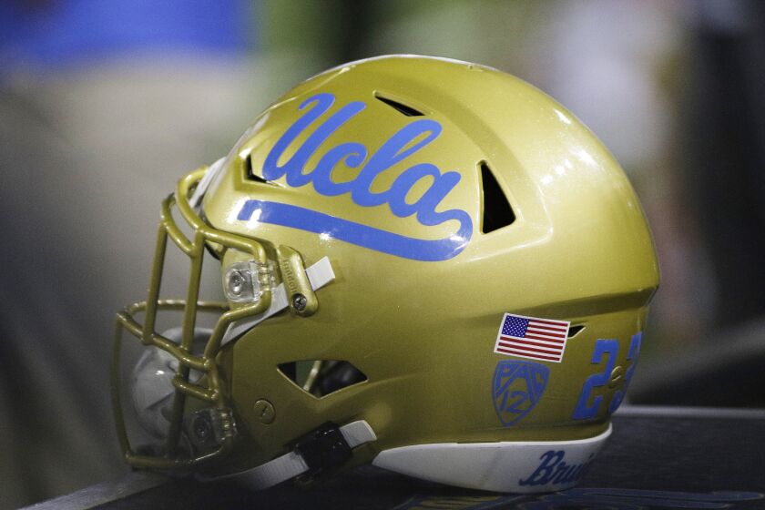 A UCLA helmet sits on the sideline during the second half of an NCAA college football game between Washington State and UCLA in Pullman, Wash., Saturday, Sept. 21, 2019. (AP Photo/Young Kwak)