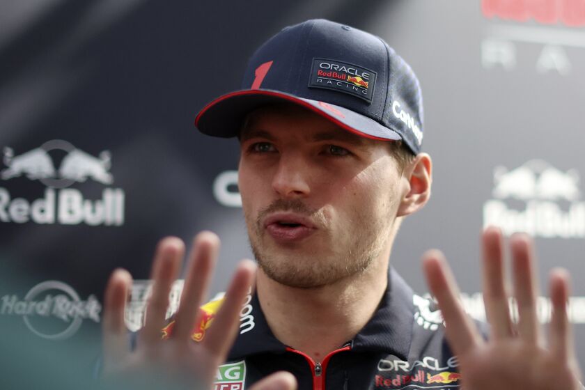 Red Bull driver Max Verstappen of Netherlands chats while in the paddock at Albert Park ahead of the Australian Formula One Grand Prix in Melbourne, Thursday, March 30, 2023. (AP Photo/Asanka Brendon Ratnayake)