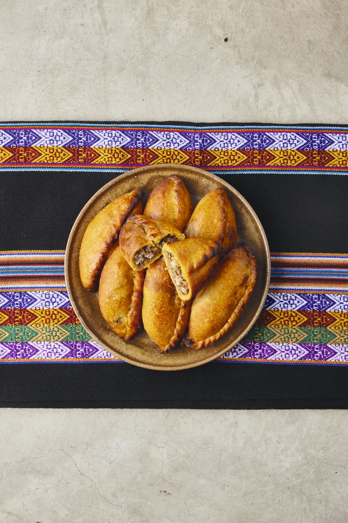 Bolivian-Style Turnovers on a plate. 