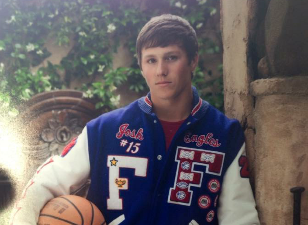 Buffalo Bills quarterback Josh Allen wearing a letterman jacket in high school.