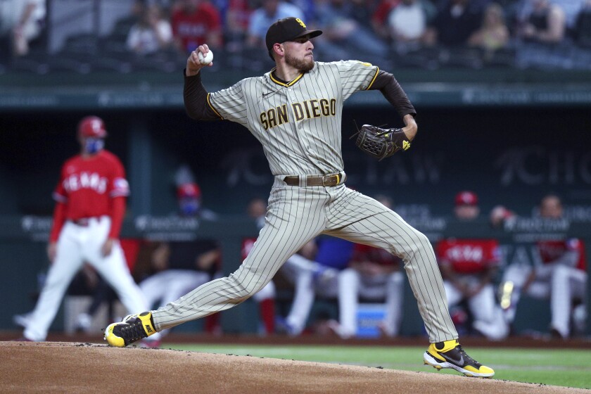 San Diego Padres starting pitcher Joe Musgrove (44) delivers a pitch to a Texas Rangers batter during the first inning of a baseball game Friday, April 9, 2021, in Arlington, Texas. (AP Photo/Richard W. Rodriguez)
