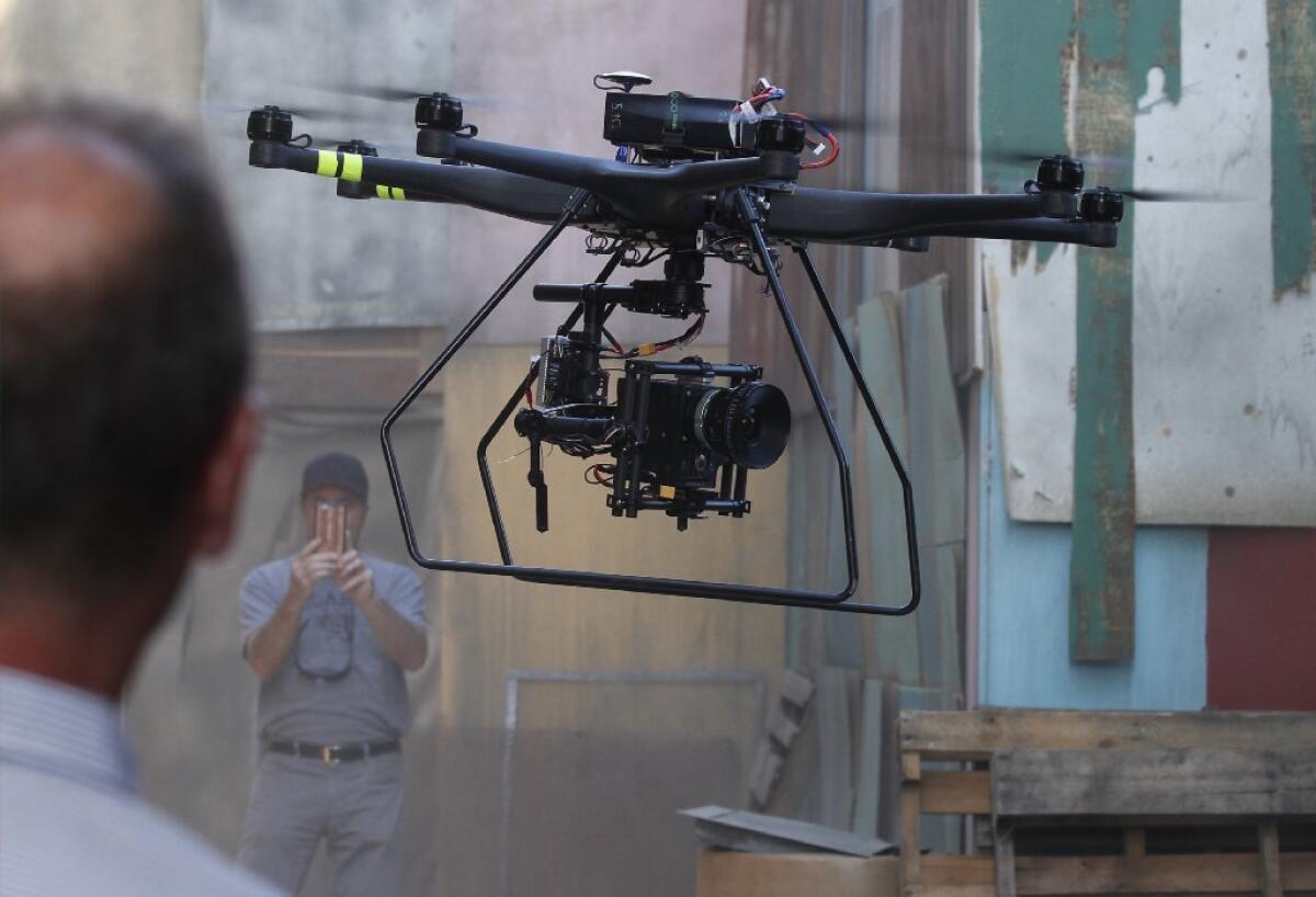 A drone lands after filming a scene on the set of "Criminal Minds: Beyond Borders" in Santa Clarita. On Wednesday, Los Angeles City Atty. Mike Feuer filed the first criminal charges against civilian drone operators under a new ordinance passed last year.