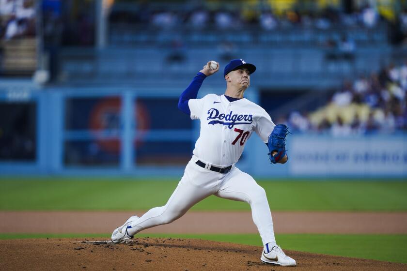 Los Angeles Dodgers starting pitcher Bobby Miller throws during the first inning of the team's baseball game against the Milwaukee Brewers, Tuesday, Aug. 15, 2023, in Los Angeles. (AP Photo/Ryan Sun)