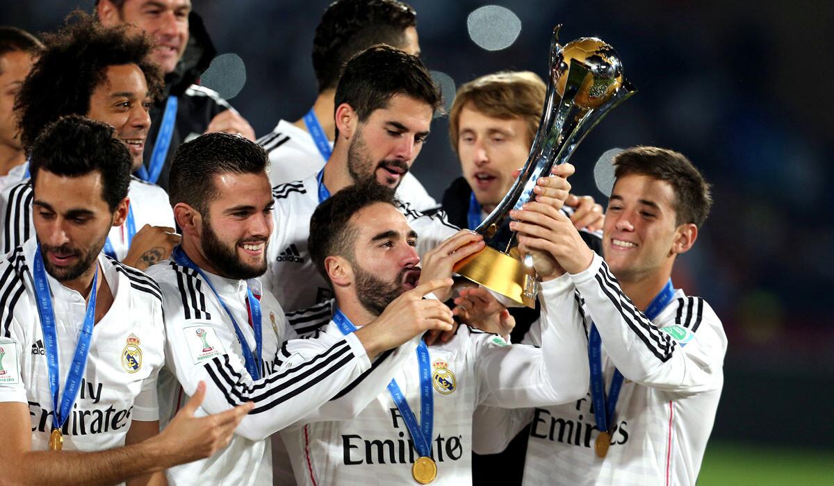 Real Madrid players celebrate with the trophy after defeating San Lorenzo in the FIFA Club World Cup championship game on Saturday in Marrakech, Morocco.