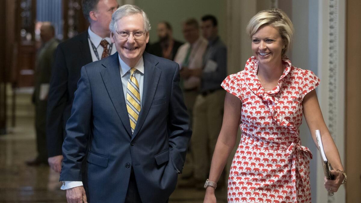 Senate Majority Leader Mitch McConnell with his director of operations, Stefanie Hager Muchow, after unveiling a new draft of healthcare legislation.