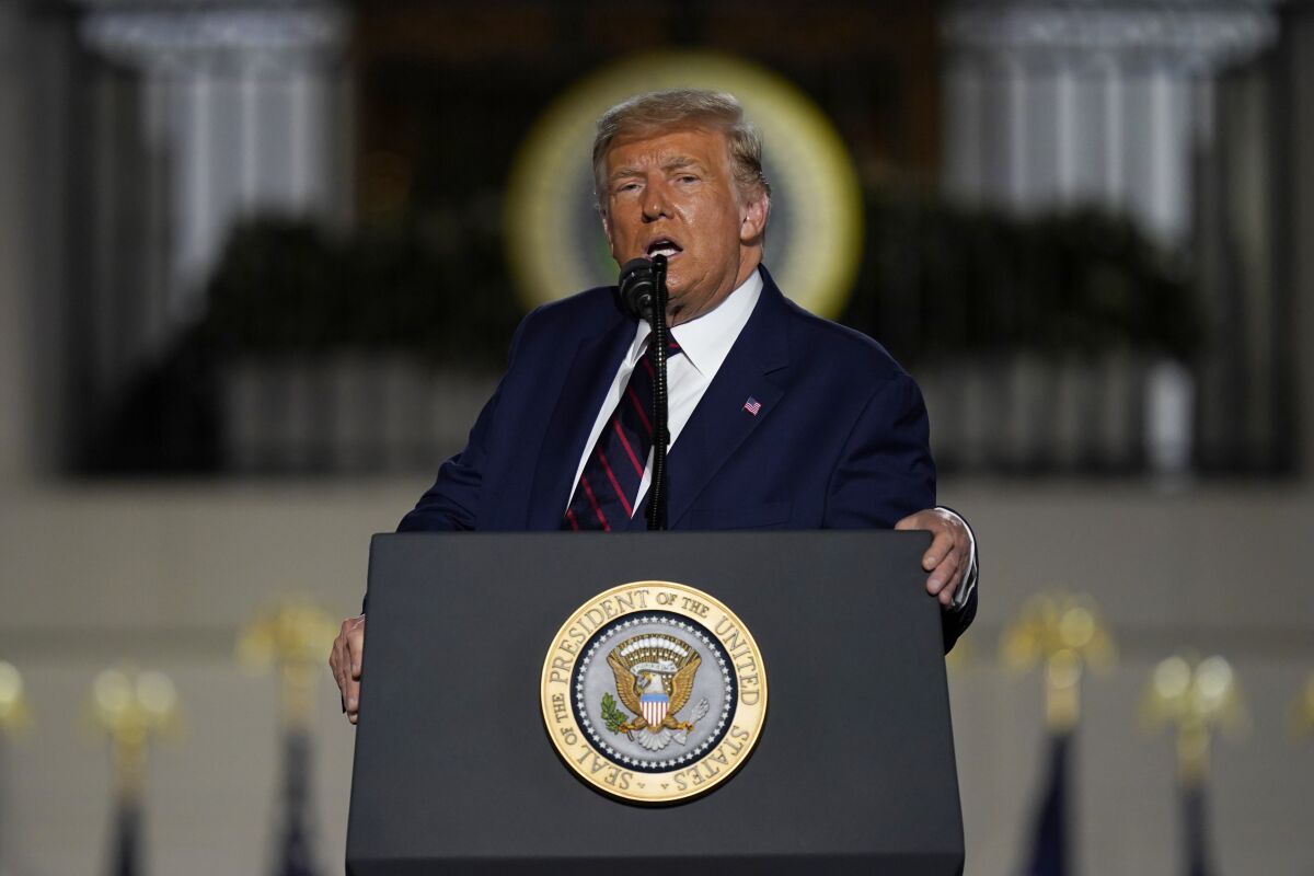President Trump leans on the podium during his acceptance speech at the Republican National Convention on Thursday night.