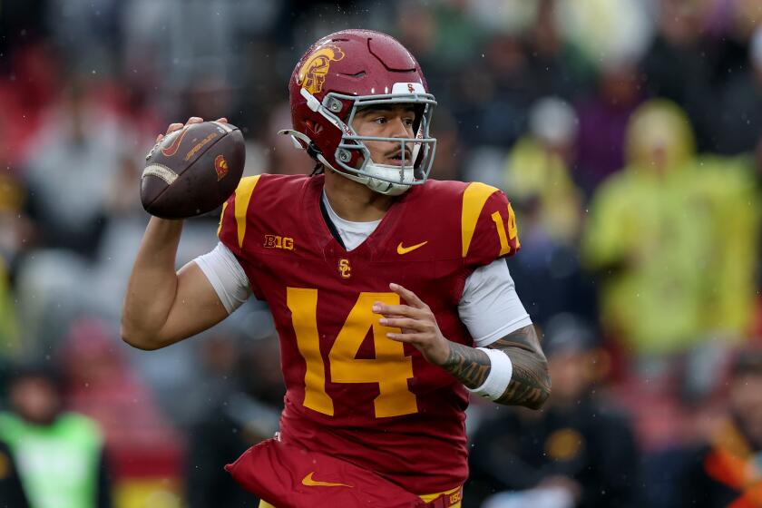 USC quarterback Jayden Maiava looks to pass in the first half against Iowa at the Coliseum on Saturday.